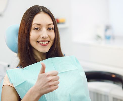 Woman in dental chair for check up